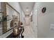 Hallway with neutral paint, decor and tiled floor at 1038 Grantham Dr, Sarasota, FL 34234
