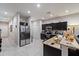 Well-lit kitchen features stainless steel appliances, granite countertops and tile flooring at 1038 Grantham Dr, Sarasota, FL 34234