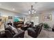 Cozy living room with decorative lighting and a large window featuring sheer curtains at 1038 Grantham Dr, Sarasota, FL 34234