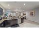 Open floor plan with a seamless flow from the kitchen to living and dining areas at 1038 Grantham Dr, Sarasota, FL 34234