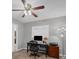 Home office with natural light, ceiling fan, desk and comfortable chair at 14204 Upper Manatee River Rd, Bradenton, FL 34212