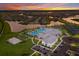 Aerial view of the community clubhouse, pool, and surrounding neighborhood at 14906 Lyla Ter, Bradenton, FL 34211
