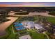 Aerial view of the community amenities including pool, tennis courts and clubhouse at 14906 Lyla Ter, Bradenton, FL 34211