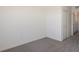 Carpeted bedroom with neutral walls, and entry to another room at 14906 Lyla Ter, Bradenton, FL 34211