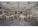 Spacious clubhouse patio with dining tables, chairs, ceiling fans and multiple televisions at 14906 Lyla Ter, Bradenton, FL 34211