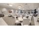 Well lit resident dining room features tables, chairs, and decorative artwork at 14906 Lyla Ter, Bradenton, FL 34211