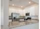 Modern kitchen with stainless steel appliances and granite countertops at 14906 Lyla Ter, Bradenton, FL 34211