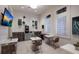 Relaxing resident lounge features tables, chairs, coffee bar, and TV at 14906 Lyla Ter, Bradenton, FL 34211