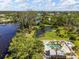 Scenic aerial view of a pool and pond, showcasing the community's natural beauty at 155 Jose Gaspar Dr # 155, Englewood, FL 34223