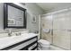 Clean and simple bathroom with a modern vanity and shower at 155 Jose Gaspar Dr # 155, Englewood, FL 34223