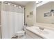 Bright bathroom featuring a vanity with a single sink and shower at 155 Jose Gaspar Dr # 155, Englewood, FL 34223