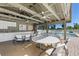 Spacious cabana featuring seating and counter space, perfect for outdoor entertaining by the pool at 155 Jose Gaspar Dr # 155, Englewood, FL 34223