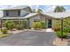 Charming single-story home featuring a well-maintained yard with mature landscaping and a private driveway at 155 Jose Gaspar Dr # 155, Englewood, FL 34223