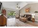 Comfortable living room with large windows and modern furniture at 155 Jose Gaspar Dr # 155, Englewood, FL 34223
