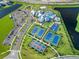 Aerial view of community amenities featuring tennis courts, basketball court, pool, clubhouse, and parking at 15607 White Linen Dr, Lakewood Ranch, FL 34211