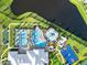 Overhead view of resort-style pool, splash park, basketball court, and putting green at 15607 White Linen Dr, Lakewood Ranch, FL 34211