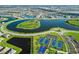 An aerial view of the community with a lake, tennis courts, and a basketball court at 15607 White Linen Dr, Lakewood Ranch, FL 34211
