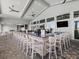 Clubhouse bar area with modern fixtures, ample seating, and TVs for entertainment at 15607 White Linen Dr, Lakewood Ranch, FL 34211