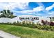 Community entrance sign for Lorraine Lakes at Lakewood Ranch with lush landscaping at 15607 White Linen Dr, Lakewood Ranch, FL 34211