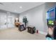 Bright game room featuring a collection of arcade games and a clean, modern design at 15607 White Linen Dr, Lakewood Ranch, FL 34211