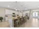 Spacious open-concept kitchen with granite counters, stainless steel appliances, and pendant lighting at 15607 White Linen Dr, Lakewood Ranch, FL 34211