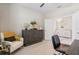 Bright office space with a stylish cabinet and decor, providing an ideal workspace at home at 15607 White Linen Dr, Lakewood Ranch, FL 34211