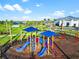 Community playground with colorful slides and playground equipment at 15607 White Linen Dr, Lakewood Ranch, FL 34211