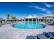 Resort-style pool with ample seating, lush landscaping, and a modern clubhouse, perfect for leisure at 15607 White Linen Dr, Lakewood Ranch, FL 34211