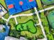 Aerial view of the community putting green surrounded by lush, green grass at 15607 White Linen Dr, Lakewood Ranch, FL 34211