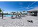 Resort style community pool with lounge chairs and a covered seating area at 15607 White Linen Dr, Lakewood Ranch, FL 34211