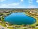 Beautiful community lake view surrounded by lush landscaping and walking path at 17522 Northwood Pl, Bradenton, FL 34202