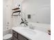 Well-lit bathroom featuring a sink, vanity, tub-shower combo, and stylish decor at 1901 Everson St, Bradenton, FL 34208