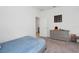 Bright bedroom features neutral walls, carpet, and a gray dresser at 1901 Everson St, Bradenton, FL 34208