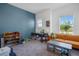 Bright room featuring a large window, blue accent wall, and ample toy storage at 1901 Everson St, Bradenton, FL 34208