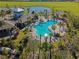 Aerial view of the luxurious community pool area surrounded by lush landscaping at 1901 Everson St, Bradenton, FL 34208