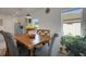 Cozy dining area with a wooden table, natural light, and a view of the kitchen at 1901 Everson St, Bradenton, FL 34208