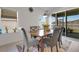 Dining room featuring a wooden table and chairs, and a sliding glass door at 1901 Everson St, Bradenton, FL 34208