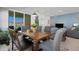 Bright dining room featuring a wooden table, chairs, and a view of the outdoors at 1901 Everson St, Bradenton, FL 34208