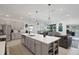 Well-designed kitchen with large island, stainless steel appliances, and gray cabinets at 1901 Everson St, Bradenton, FL 34208