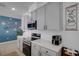 Stylish kitchen boasts sleek gray cabinetry, stainless steel appliances, and modern countertops for a contemporary appeal at 1901 Everson St, Bradenton, FL 34208