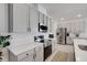 Updated kitchen showcases stainless steel appliances, bright countertops, and ample cabinet space, a chef's dream at 1901 Everson St, Bradenton, FL 34208