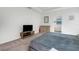 Bright main bedroom features neutral walls, carpet, and an entertainment center at 1901 Everson St, Bradenton, FL 34208