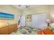 Bedroom featuring wood floors, double closets, and a decorative dresser at 2047 Roselawn St, Sarasota, FL 34231