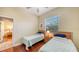 Bedroom with hardwood floors and a ceiling fan above two twin beds at 2047 Roselawn St, Sarasota, FL 34231