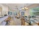 A well-appointed dining area opens into the living room and features a view of the outdoor seating at 2047 Roselawn St, Sarasota, FL 34231