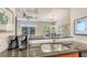 Kitchen counter view featuring bar seating and a Keurig coffeemaker at 2047 Roselawn St, Sarasota, FL 34231