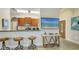 The kitchen bar features wooden stools and granite counters, flowing into the dining area at 2047 Roselawn St, Sarasota, FL 34231