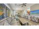 The living room has an open floor plan, with a ceiling fan and direct access to the kitchen at 2047 Roselawn St, Sarasota, FL 34231