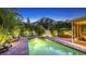 Tropical outdoor living at its finest with a pool, patio, exterior dining area, and mature landscaping at 2047 Roselawn St, Sarasota, FL 34231