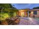 Comfortable outdoor living with a pool, brick patio and exterior dining and grill area at 2047 Roselawn St, Sarasota, FL 34231